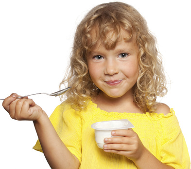 Young Girl Enjoying a Yogurt Cup